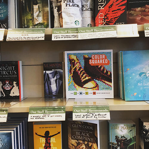 Color Squared book on a bookshelf in a store