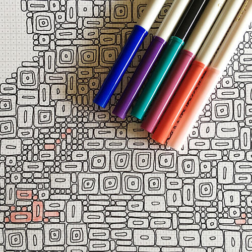 further out photo of rounded-corners rectangles, the bigger ones with small inside holes, a few colored in with markers in photo